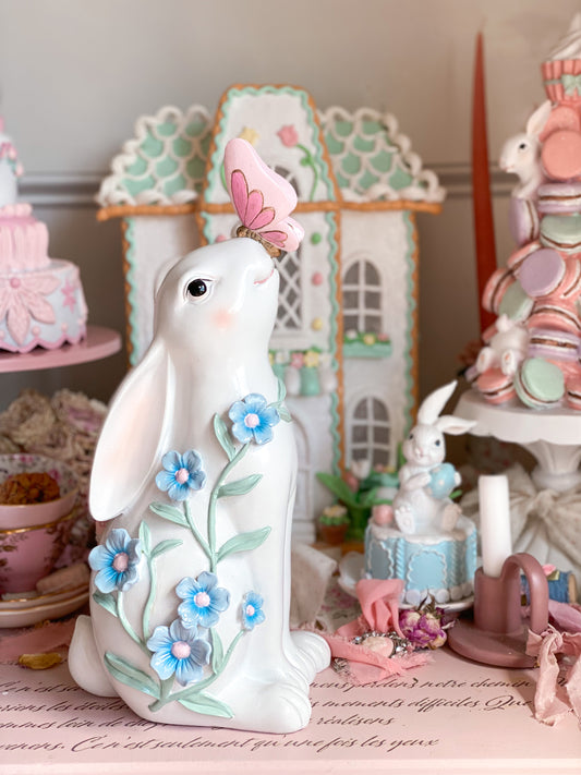 Bespoke Hand Painted White Easter Bunny with Pastel Blue Flowers and a Pink and Gold Butterfly