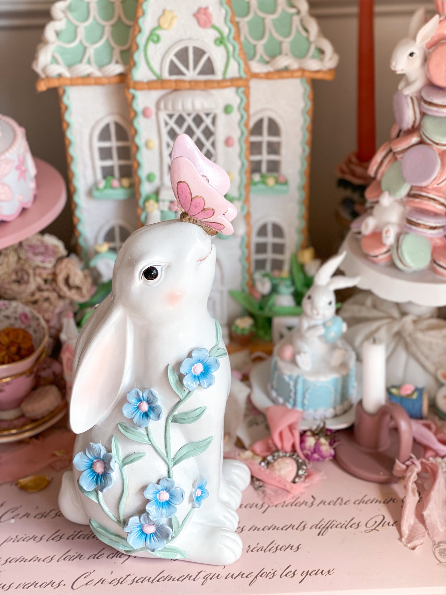 Bespoke Hand Painted White Easter Bunny with Pastel Blue Flowers and a Pink and Gold Butterfly