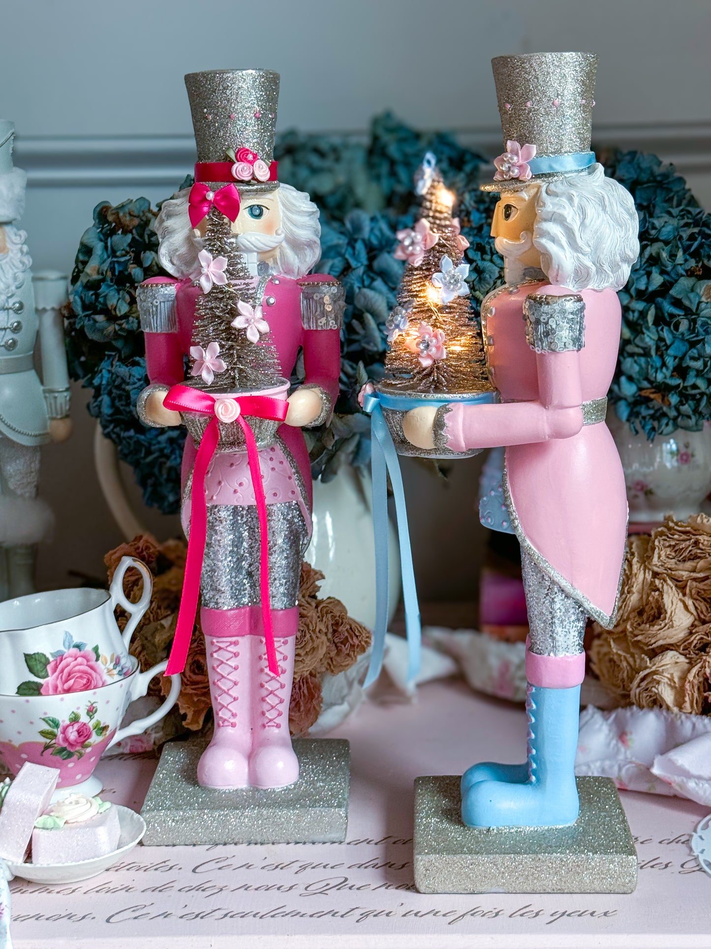 Bespoke Pastel Pink, Blue and Silver Hand Painted Nutcracker holding LED Light up Tree with Flowers and Bows