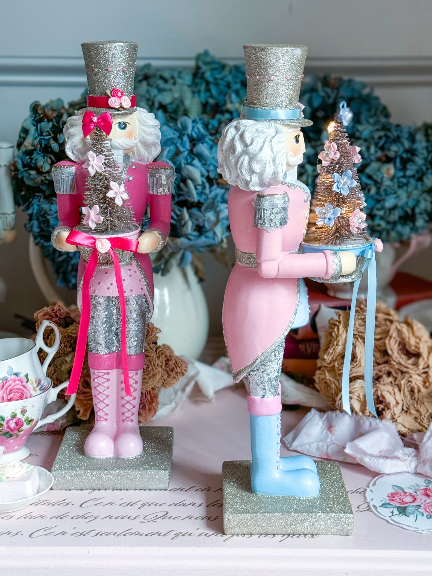 Bespoke Pastel Pink, Blue and Silver Hand Painted Nutcracker holding LED Light up Tree with Flowers and Bows