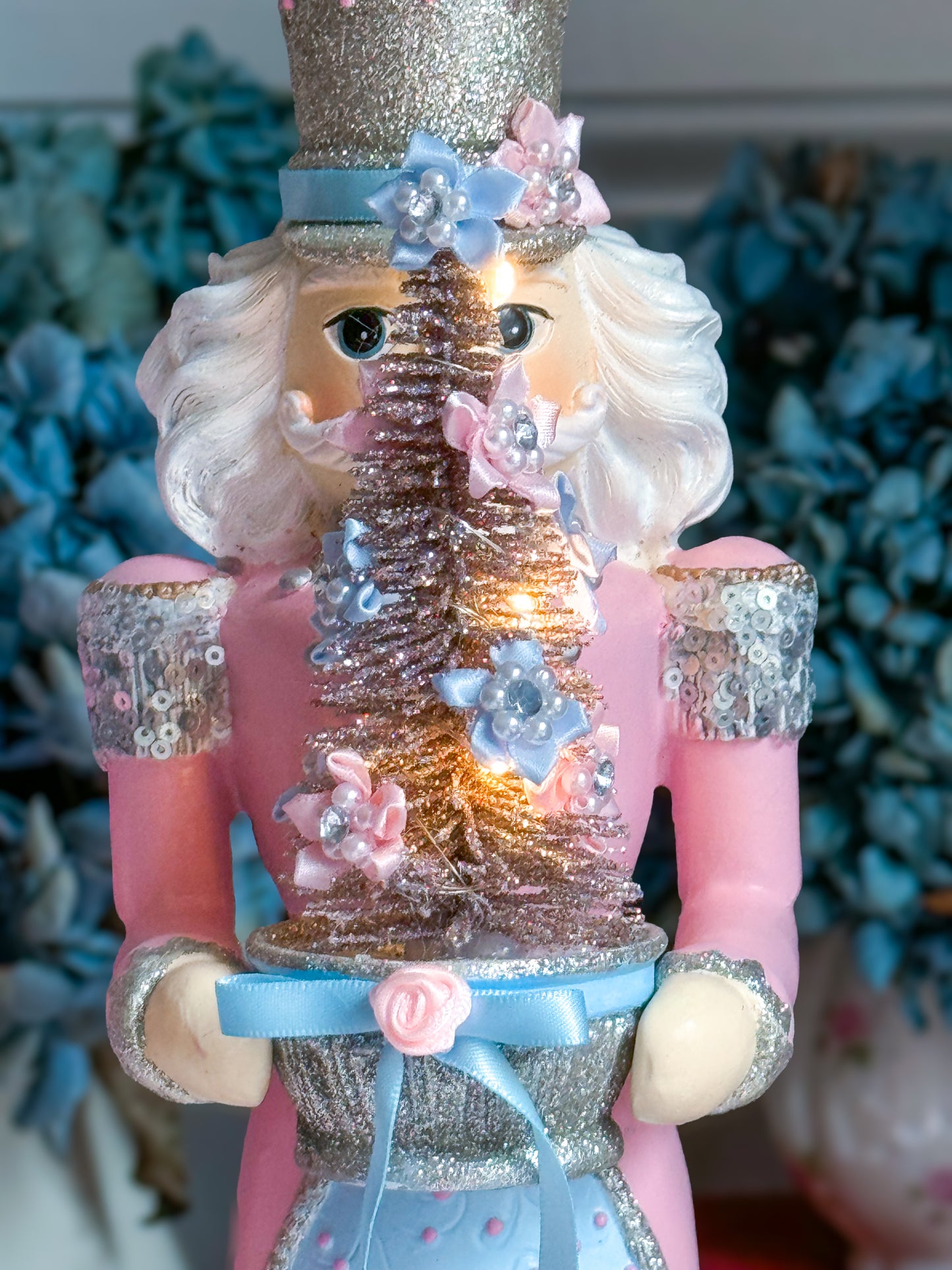 Bespoke Pastel Pink, Blue and Silver Hand Painted Nutcracker holding LED Light up Tree with Flowers and Bows