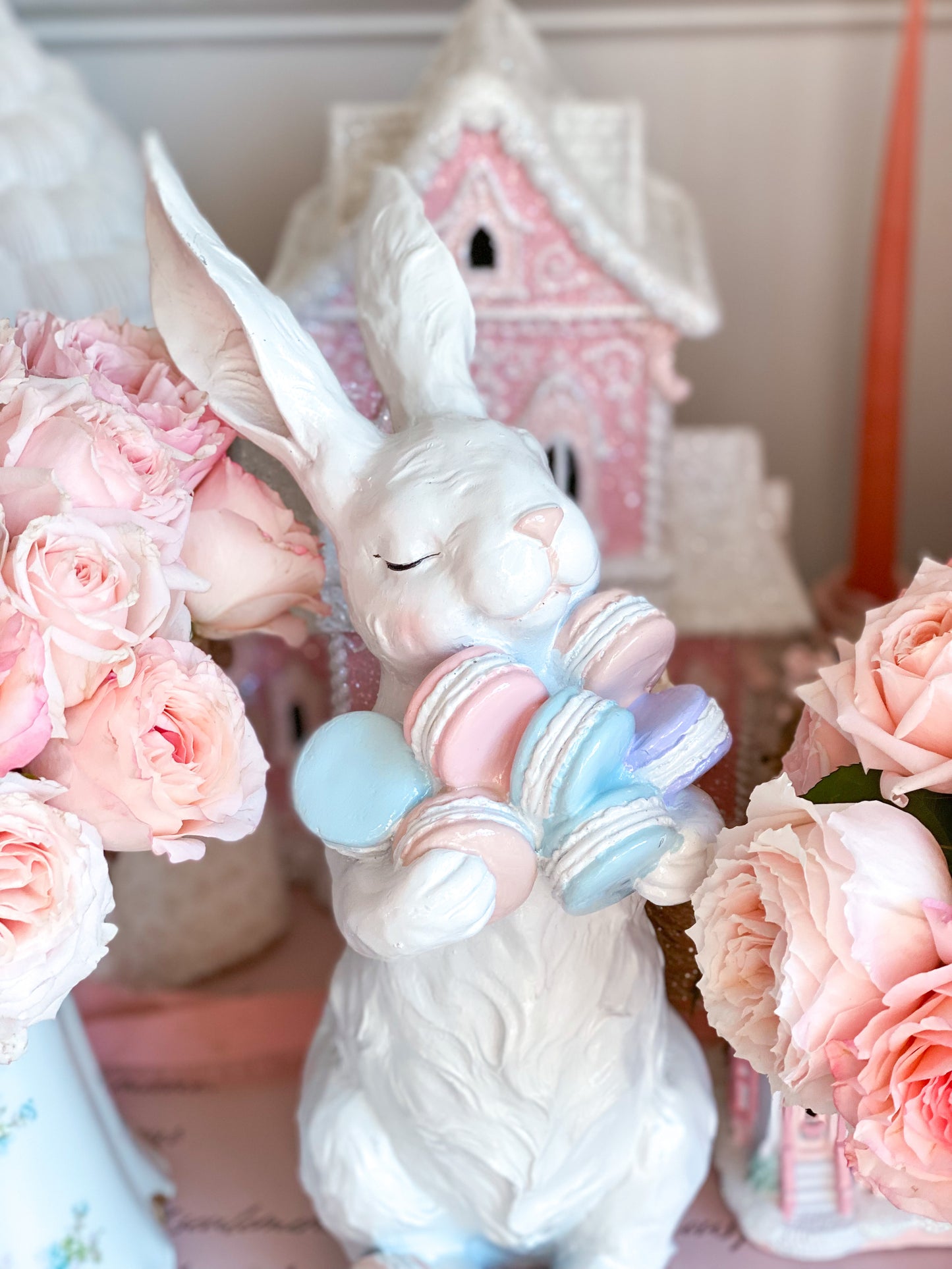 Easter Bunny Figurine Holding Pastel Pink, Blue and Purple Macarons