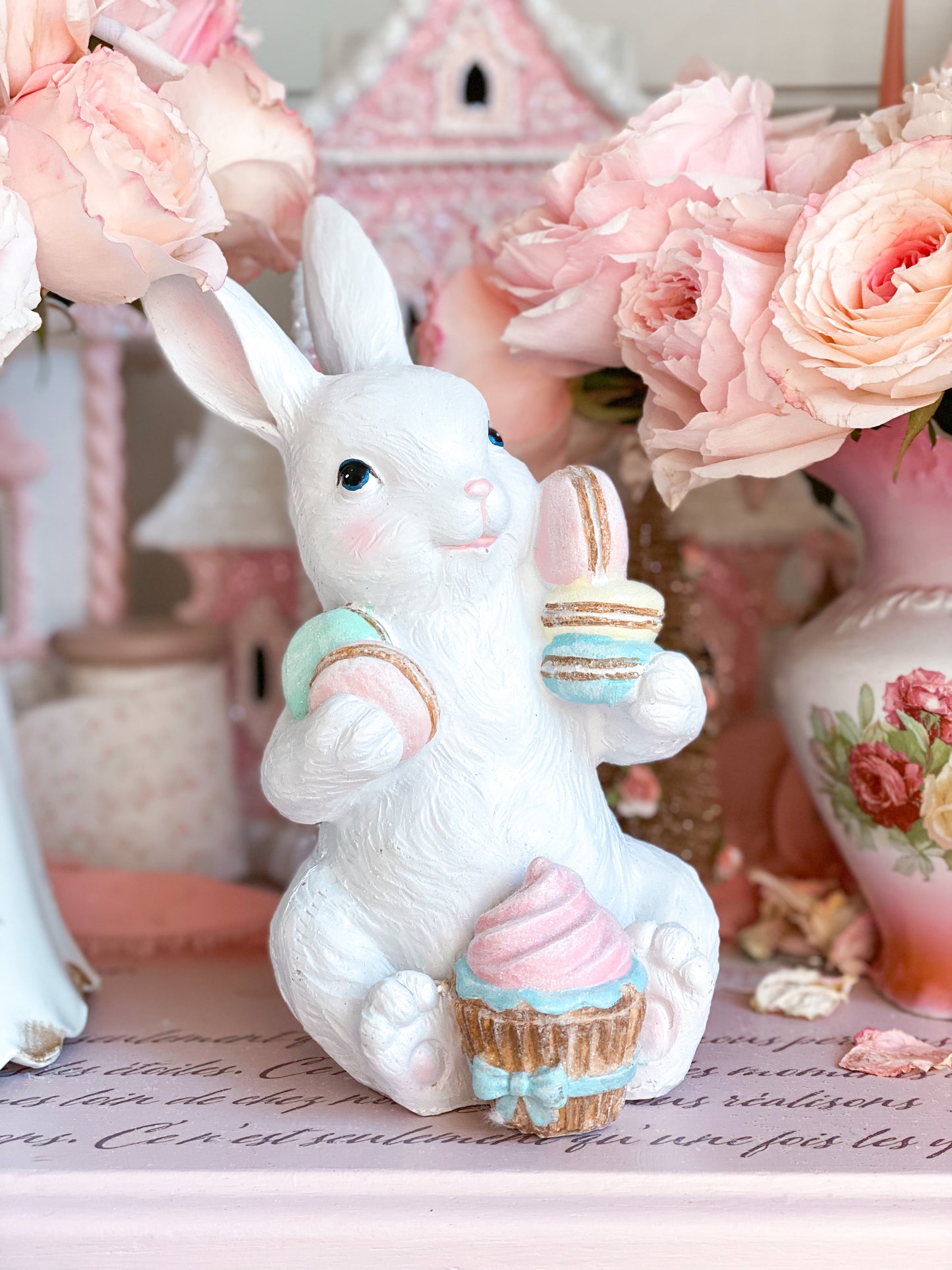 Easter Bunny Figurine with Pastel Pink Blue Green Yellow Macarons and Cupcake