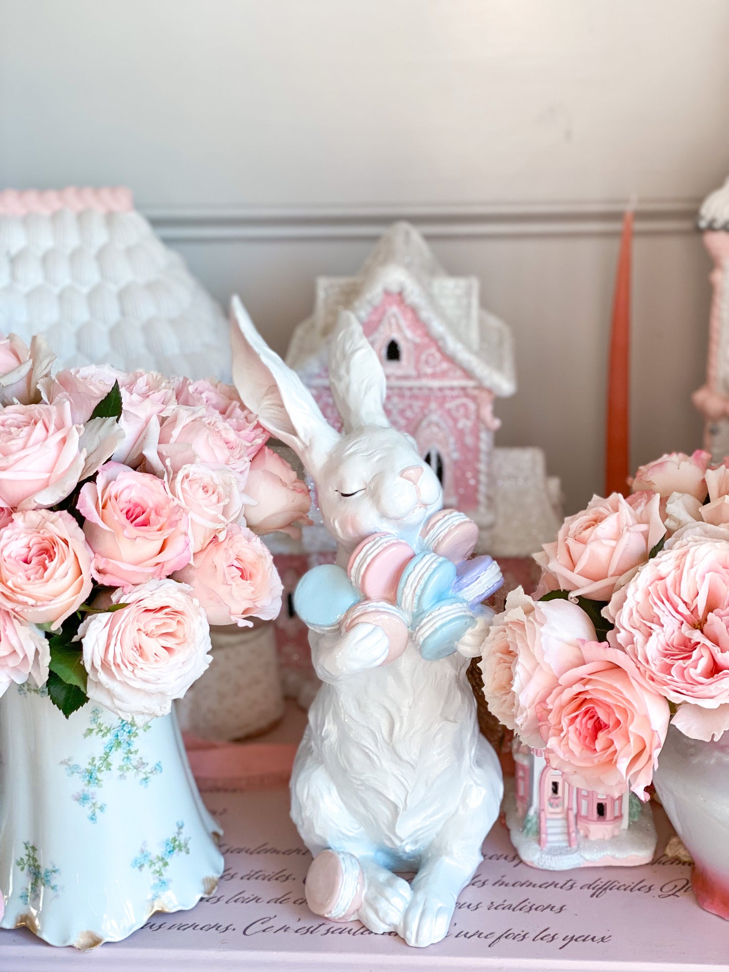 Easter Bunny Figurine Holding Pastel Pink, Blue and Purple Macarons