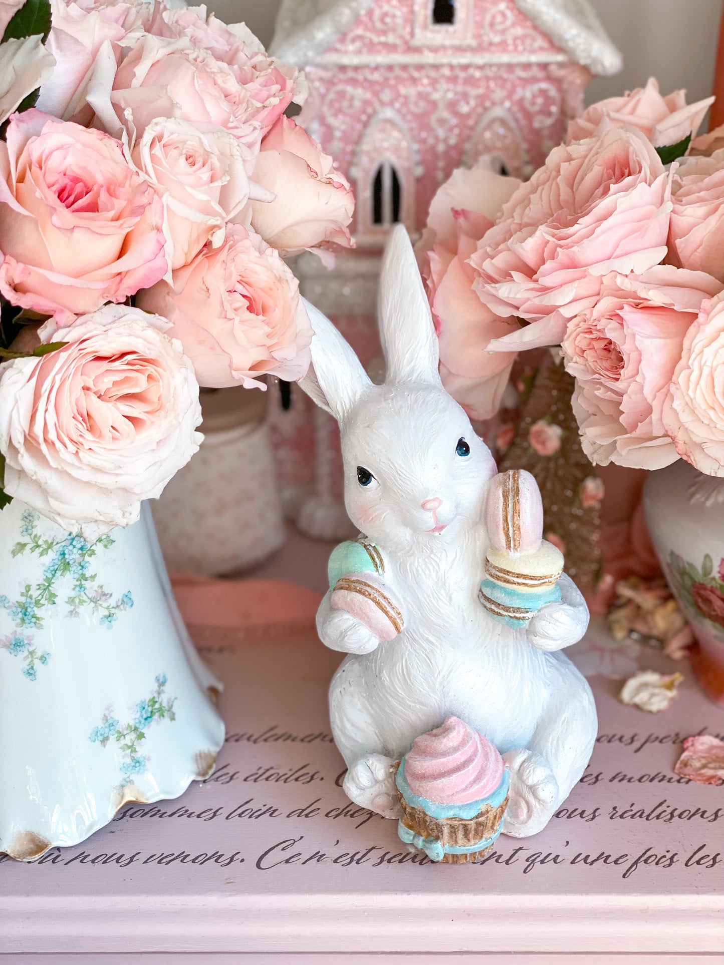 Easter Bunny Figurine with Pastel Pink Blue Green Yellow Macarons and Cupcake