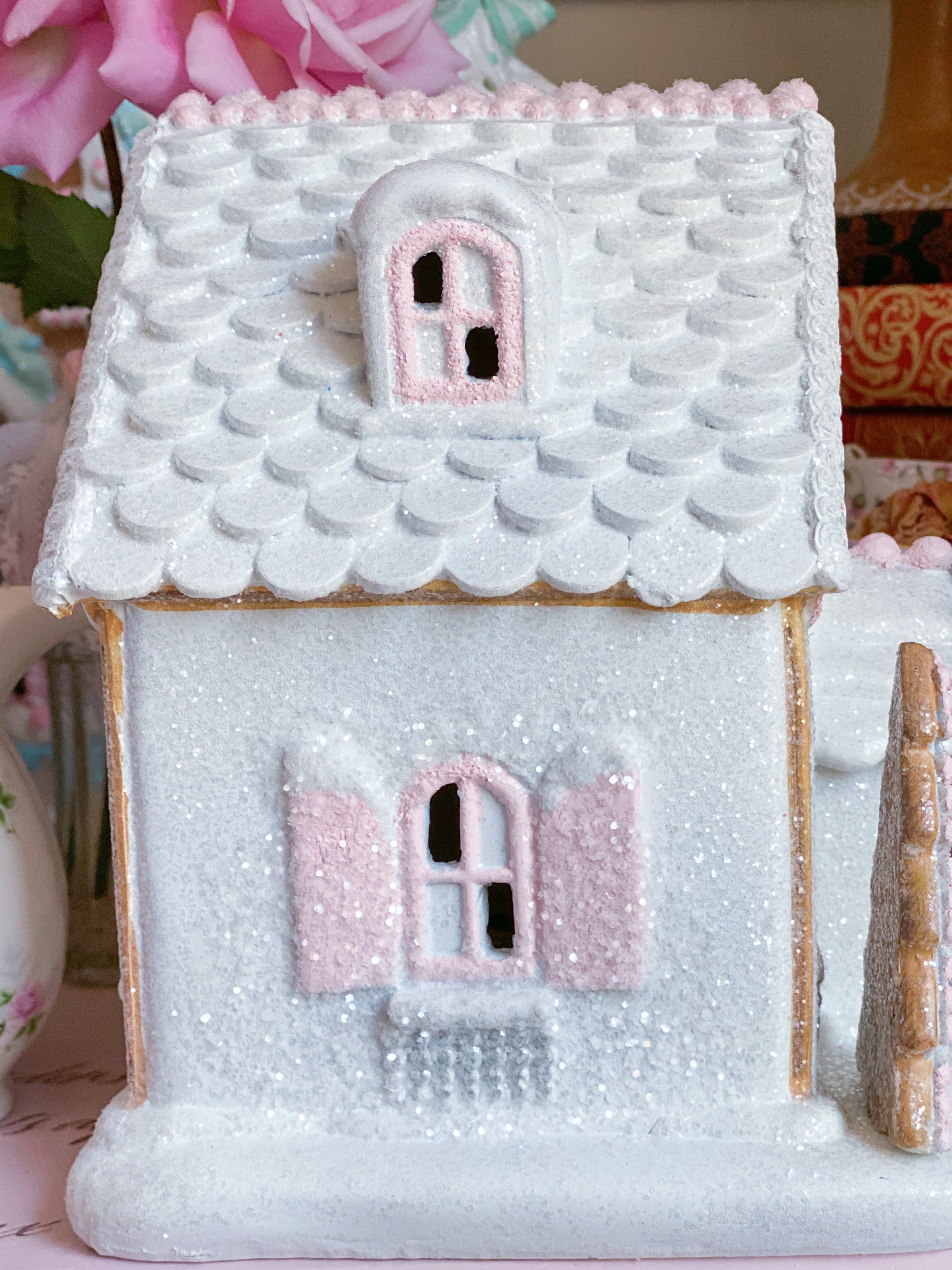 Pastel pink and white light up factory gingerbread house