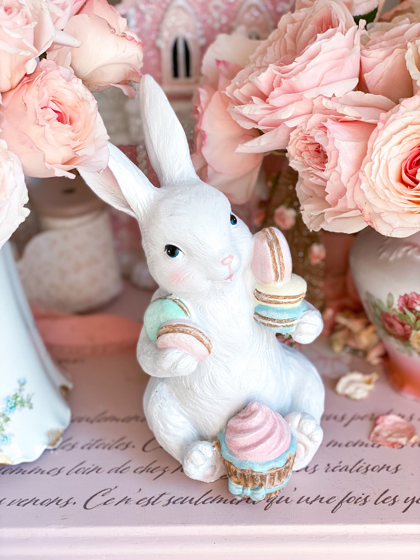 Easter Bunny Figurine with Pastel Pink Blue Green Yellow Macarons and Cupcake