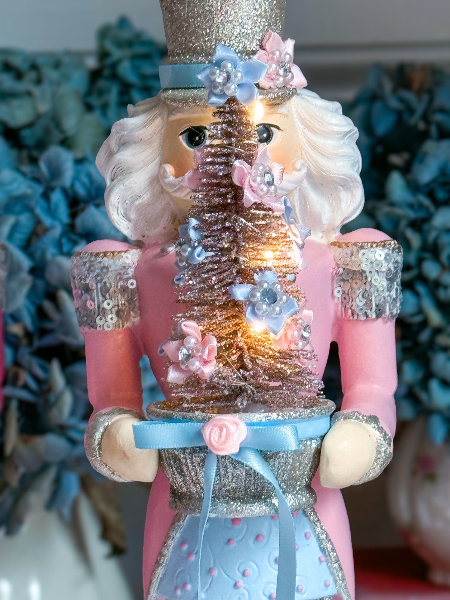 Bespoke Pastel Pink, Blue and Silver Hand Painted Nutcracker holding LED Light up Tree with Flowers and Bows