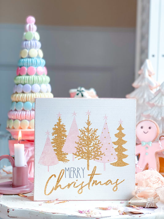 Cartel de Feliz Navidad rosa y dorado con árboles