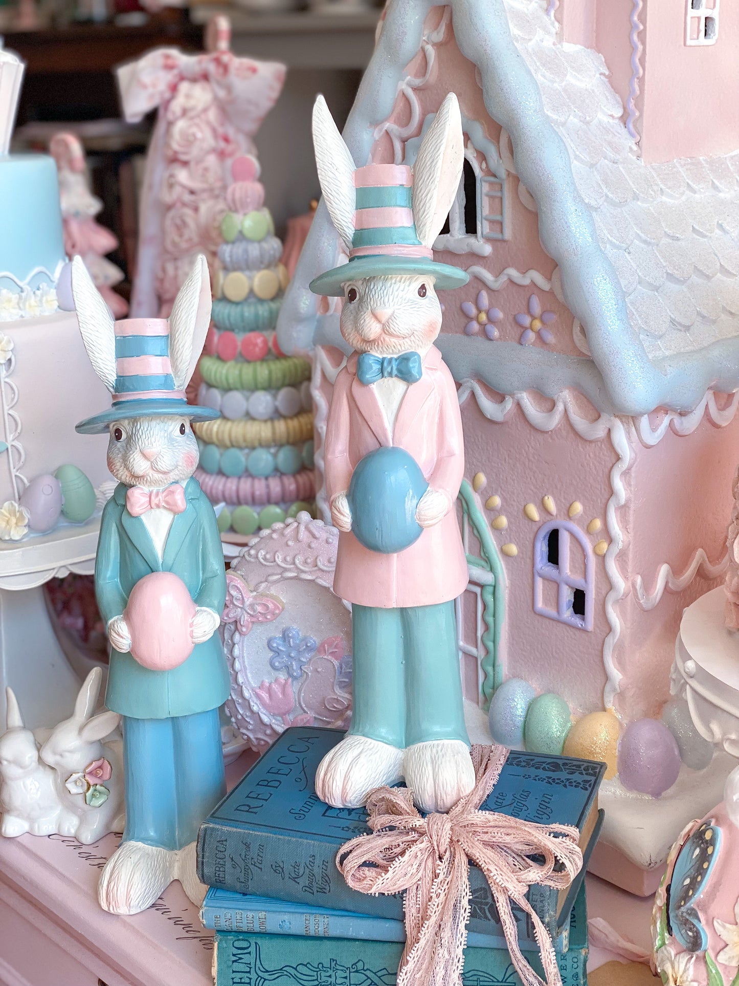 Pastel Pink and Blue Nutcracker Style Bunnies holding Easter eggs