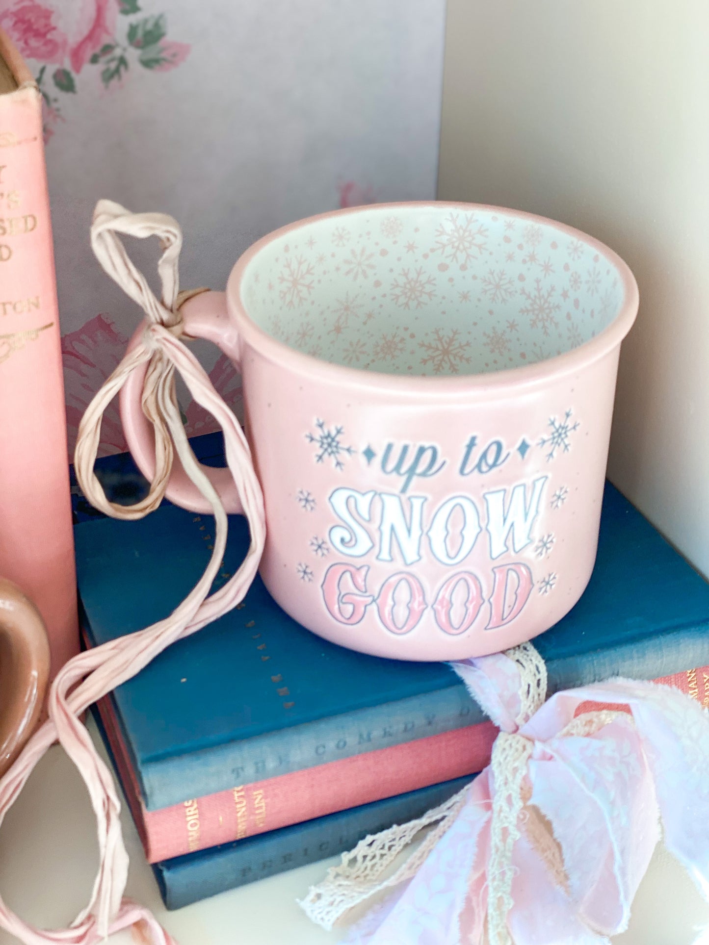 Pink “Up to Snow Good” mug with pink snowflake interior