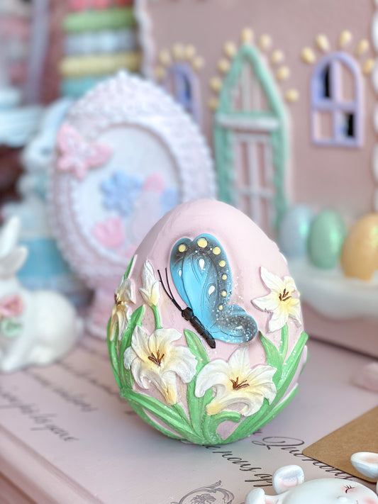 Pastel Pink Easter Egg with Blue Butterfly and Lilies