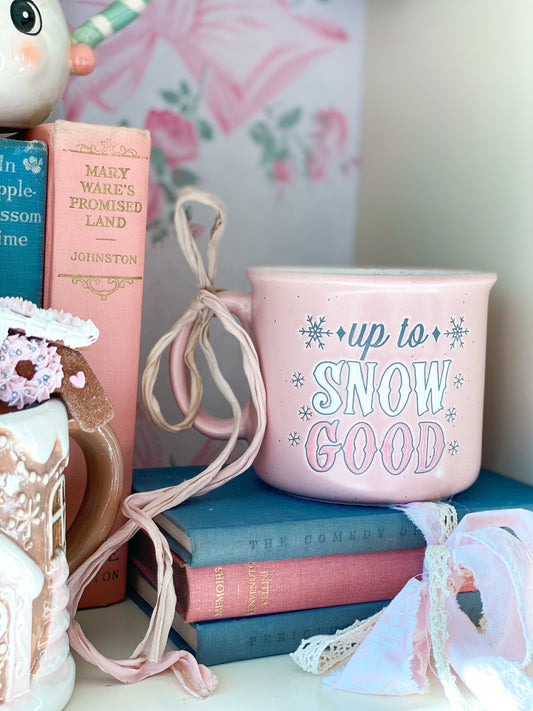 Pink “Up to Snow Good” mug with pink snowflake interior