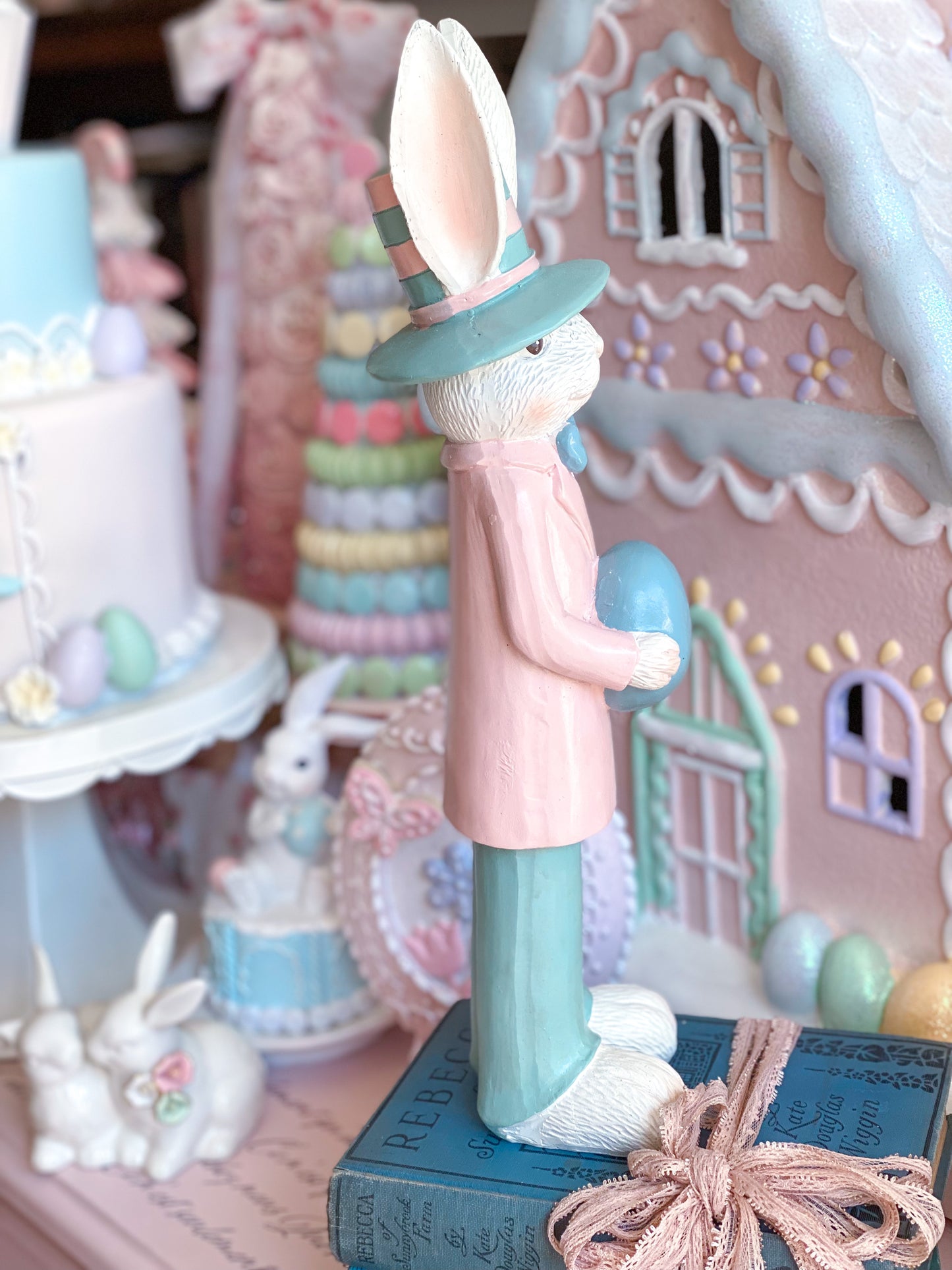 Pastel Pink and Blue Nutcracker Style Bunnies holding Easter eggs