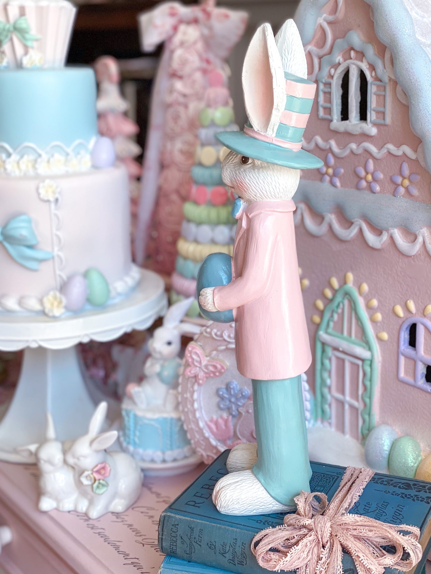 Pastel Pink and Blue Nutcracker Style Bunnies holding Easter eggs