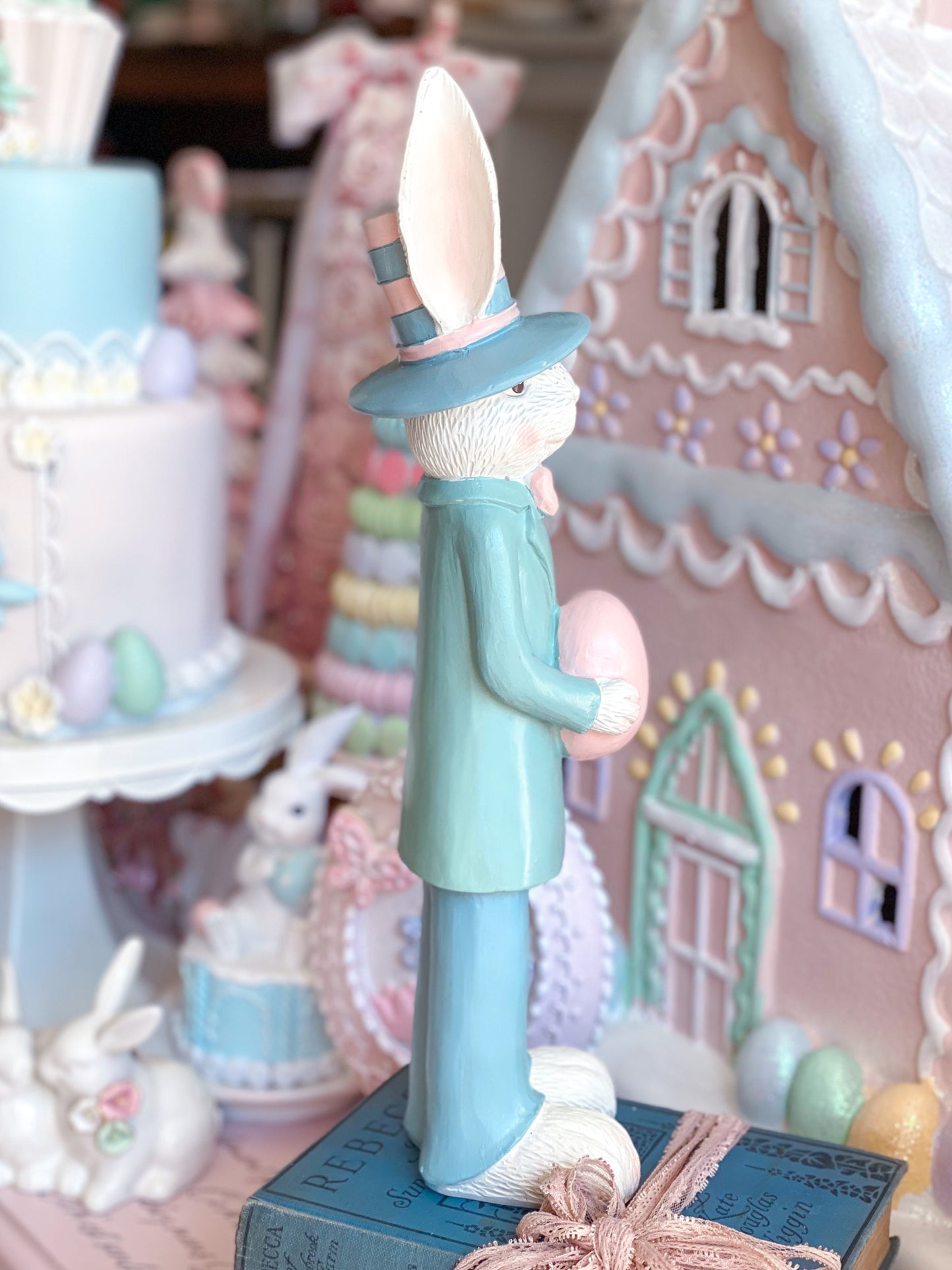 Pastel Pink and Blue Nutcracker Style Bunnies holding Easter eggs